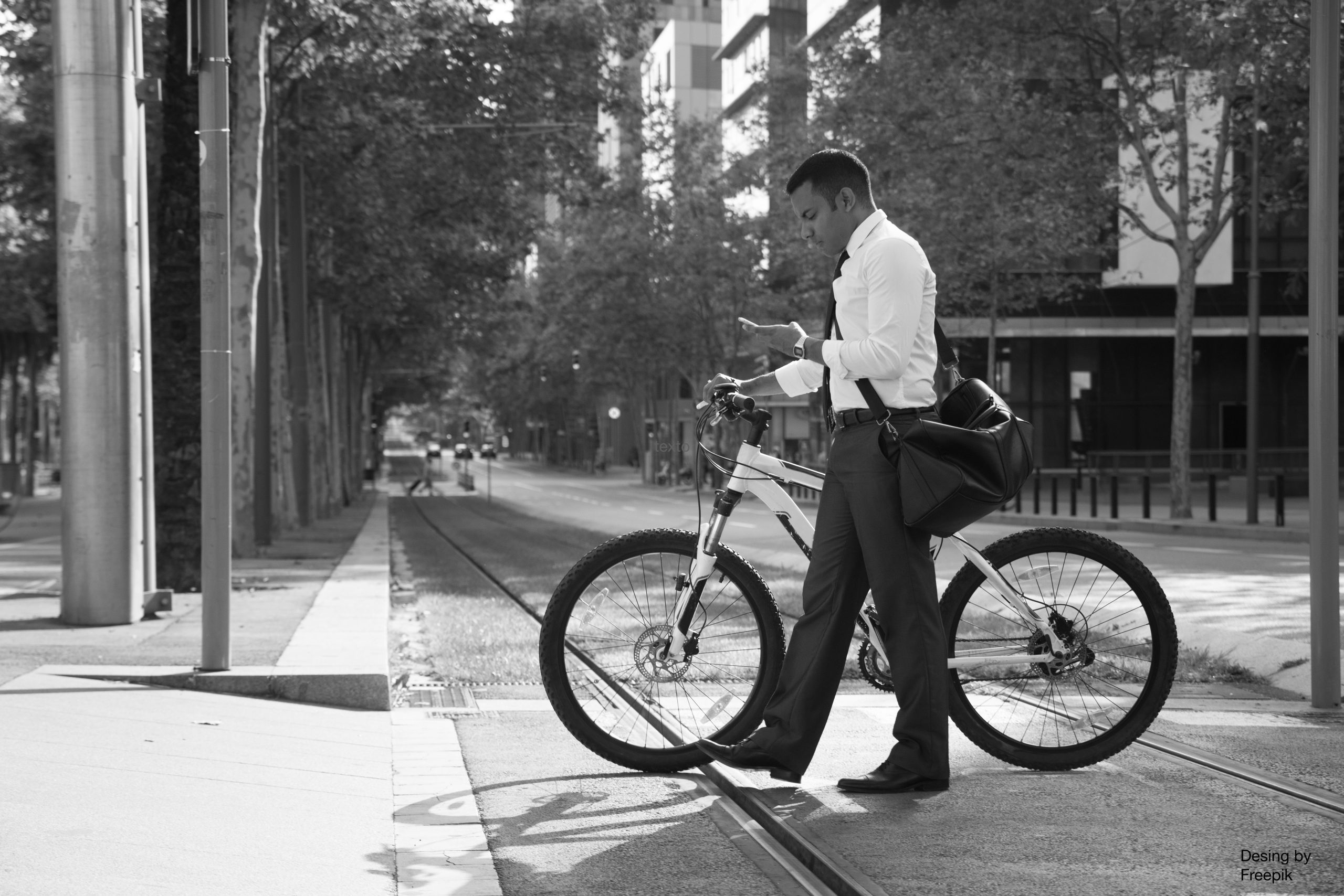 hispanic-office-worker-with-bike-phone-street